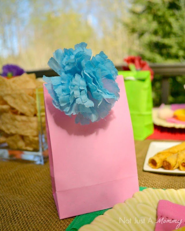 Cinco De Mayo party table flower topped favor bags