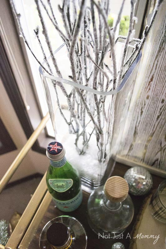 How To Decorate Your Home For The Holidays With Big Lots; snow covered branches are a lovely way to decorate