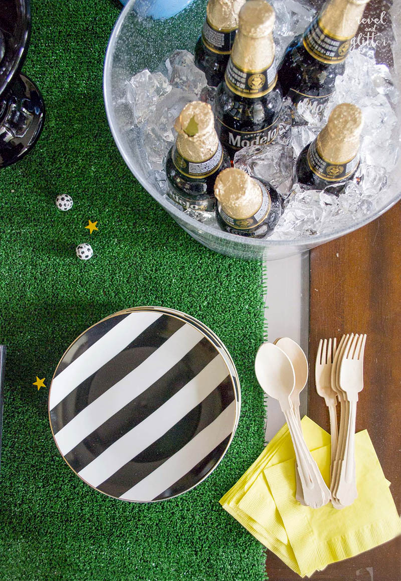 How to score with a soccer tournament watching party; striped plates and yellow napkins